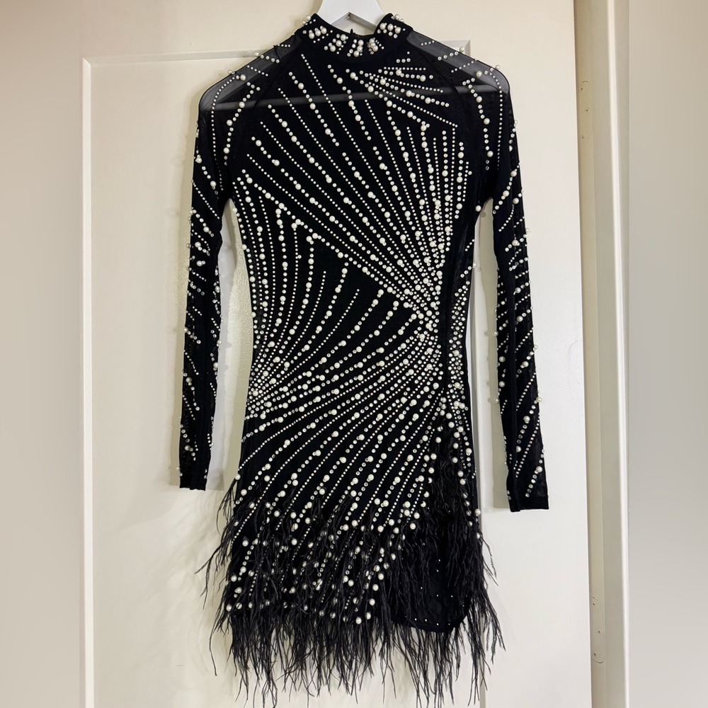 Women’s feather and rhinestone mini dress